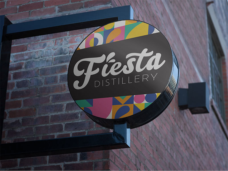 Fiesta Distillery full branding package including logo design, car signage, product packaging of labels, cans and box packaging. Fiesta Distillery Outdoor round sign